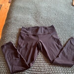 Under armour black legging with pocket top back